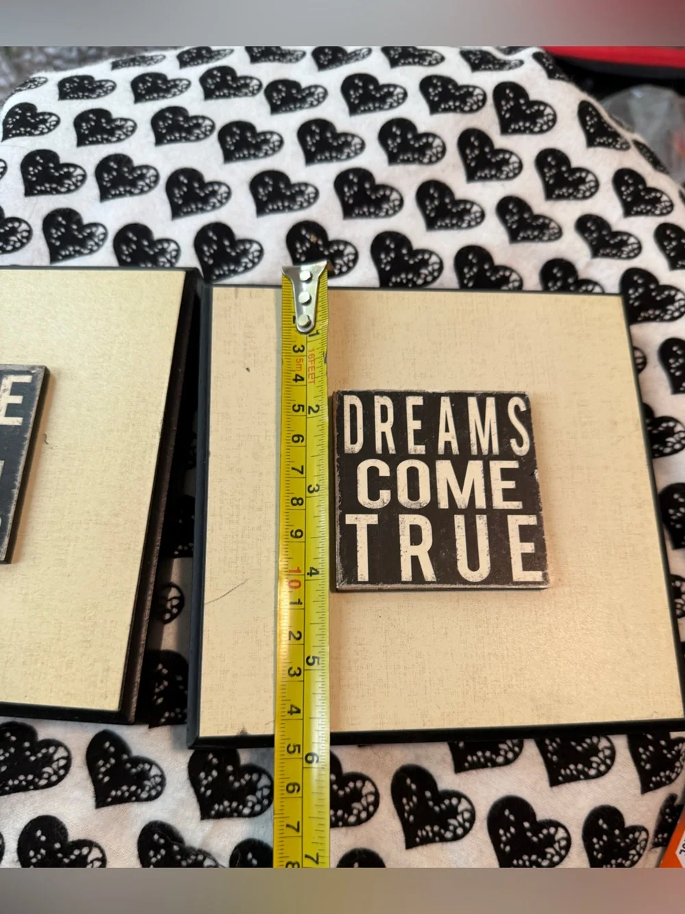 inspirational wall plaques feature distressed black typography on a white